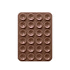 A brown silicone suction phone mount with multiple circular holes for mounting devices.