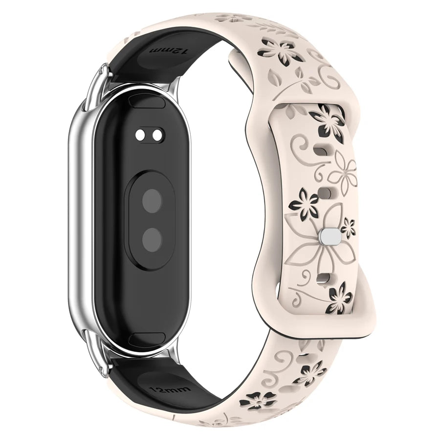 A beige silicone watch band with 3D engraved flowers and a silver casing for a smart band.