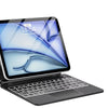 A silver Magic Keyboard case for an iPad is shown open, displaying a blue abstract graphic and a time of 14:54.