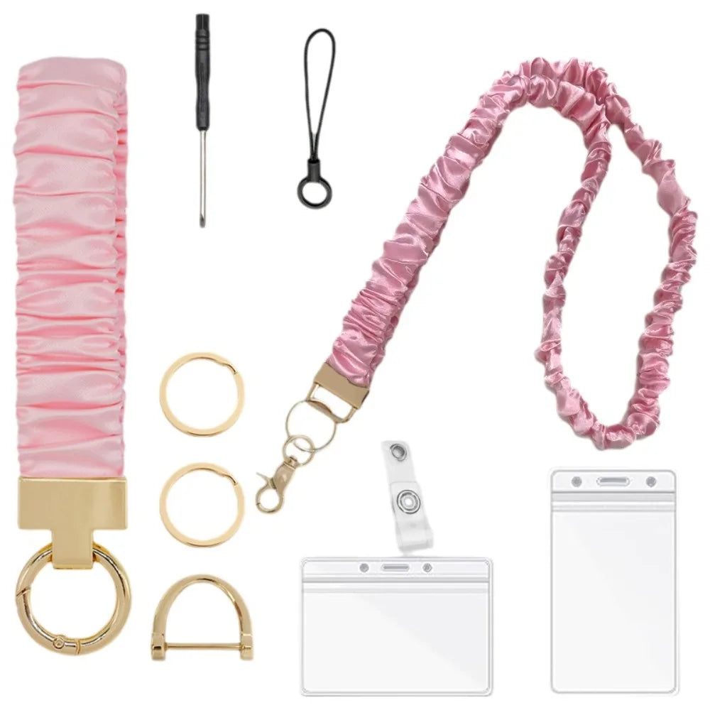 Pink stretchy breakaway ID badge lanyard with a retractable reel and gold hardware.