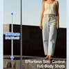 A woman is holding an effortless solo full-body shot using a tripod selfie stick for hands-free photography.