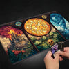 A gaming mouse pad featuring stained glass art depicting a castle and a skull.