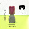 A pink and gray teacher stamp shaped like a cat face for classroom encouragement.
