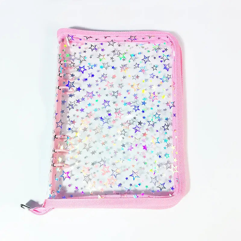 A pink transparent zipper photo binder filled with iridescent star-shaped confetti.