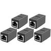 Vier graue Ethernet-Kuppler-Verlängerungskabel von oben.