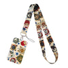 A patterned fabric lanyard featuring various cute cat designs and stars.