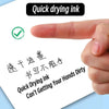 A hand points to text on a white card demonstrating the quick drying ink feature of fine point ballpoint pens.