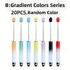 A set of twenty gradient colored rubber touch ballpoint pens with black tips displayed in a row.