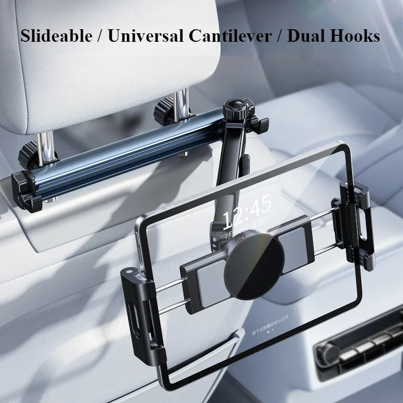 A silver adjustable tablet holder with dual hooks is mounted on a white car headrest.