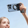 A hand holds a phone attached to a magnetic grip for effortless shooting, with a smiling woman in the background.