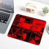 A red mouse pad featuring stylized, intense female eyes and figures in a Junji Ito style against a dark background.