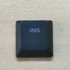 A dark blue keycap labeled INS for a Dell Alienware AW510K keyboard replacement.