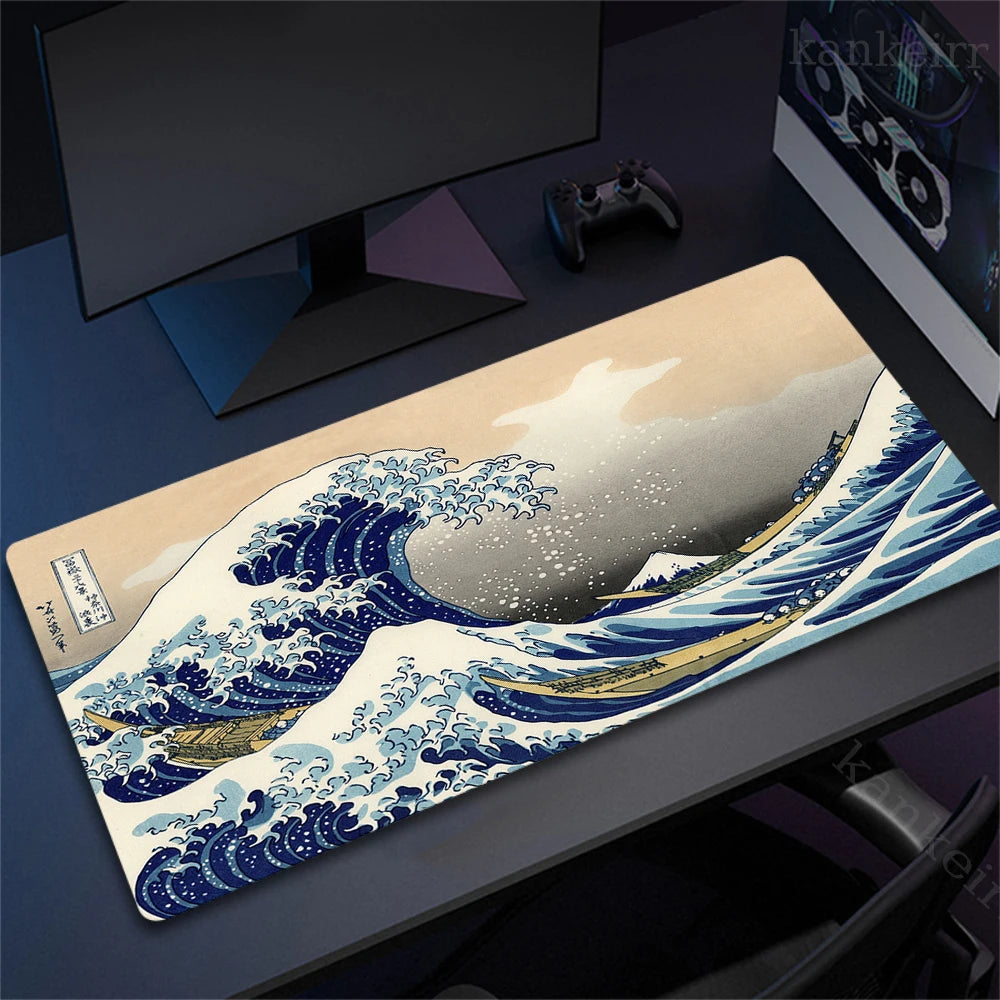 An extra large rubber desk mat mousepad featuring a watercolor illustration of a blue and white ocean wave.