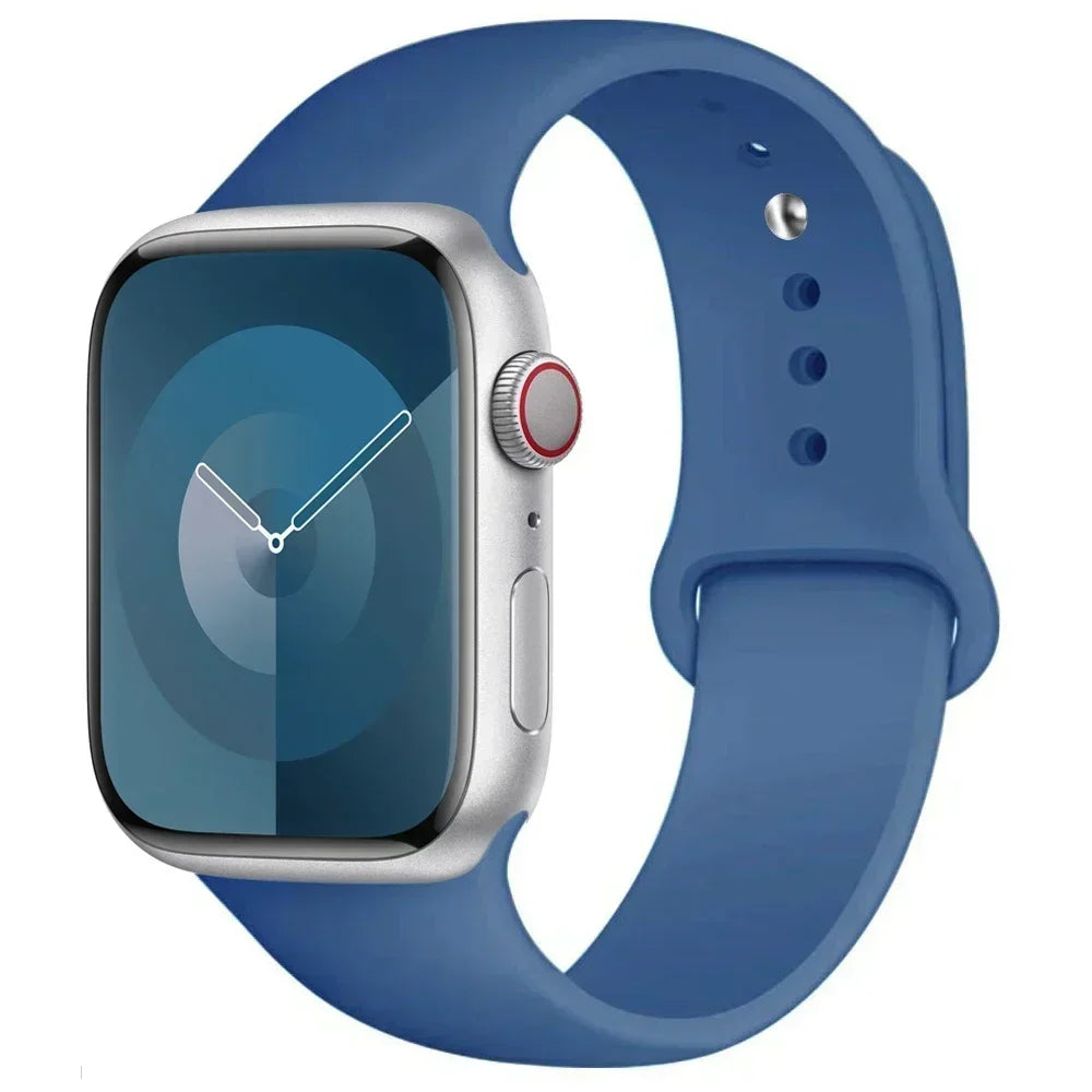 A silver Apple Watch is shown attached to a blue silicone sport band.