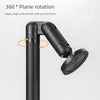 A close-up view of a black magnetic phone and tablet stand with a rotating arm for adjustable angle placement.