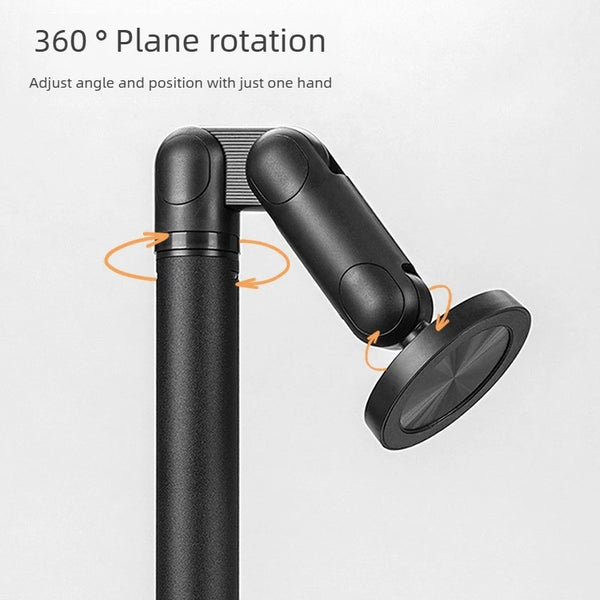A close-up view of a black magnetic phone and tablet stand with a rotating arm for adjustable angle placement.