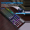 An RGB wired gaming keyboard with 104 keys displaying various colored backlights on a wooden desk.