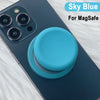 A blue phone case with a silicone magnetic grip cover is shown on a light surface.