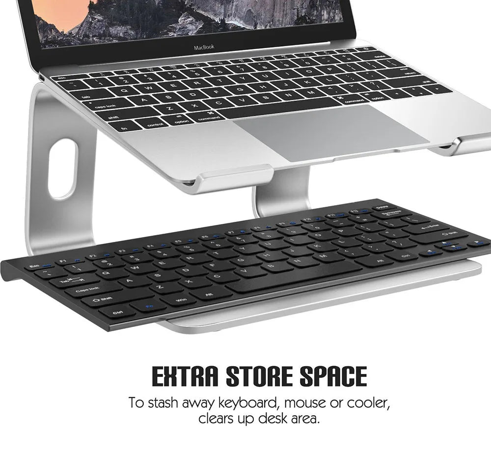 Aluminum alloy laptop stand holding a MacBook and an external keyboard.