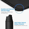 Close-up of a black gaming mousepad showing durable stitched edges and high elastic natural rubber material