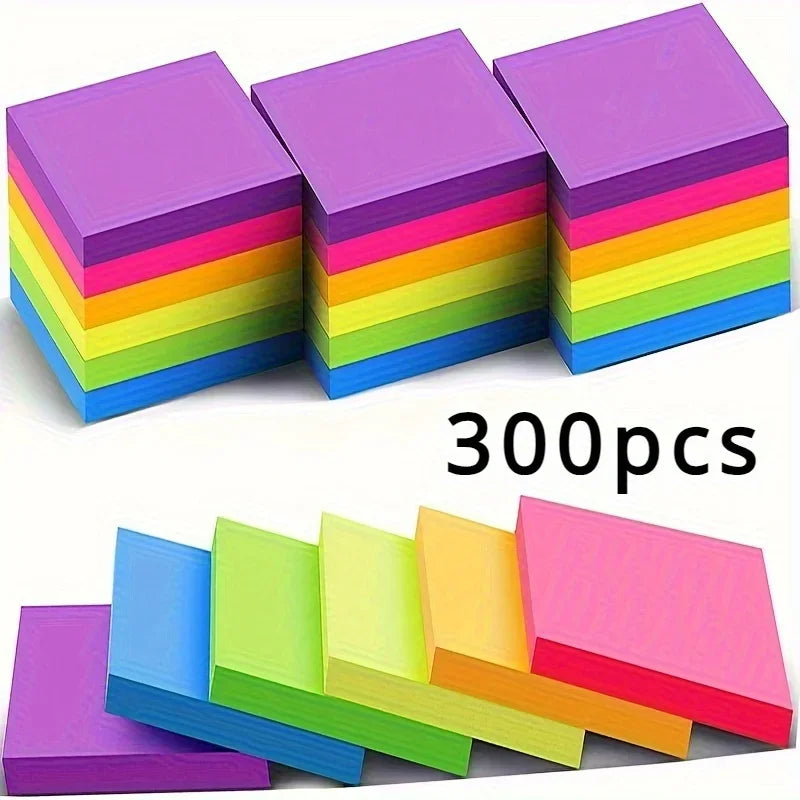 A stack of vibrant neon colored sticky notes in various shades of pink, purple, yellow, green, and blue.