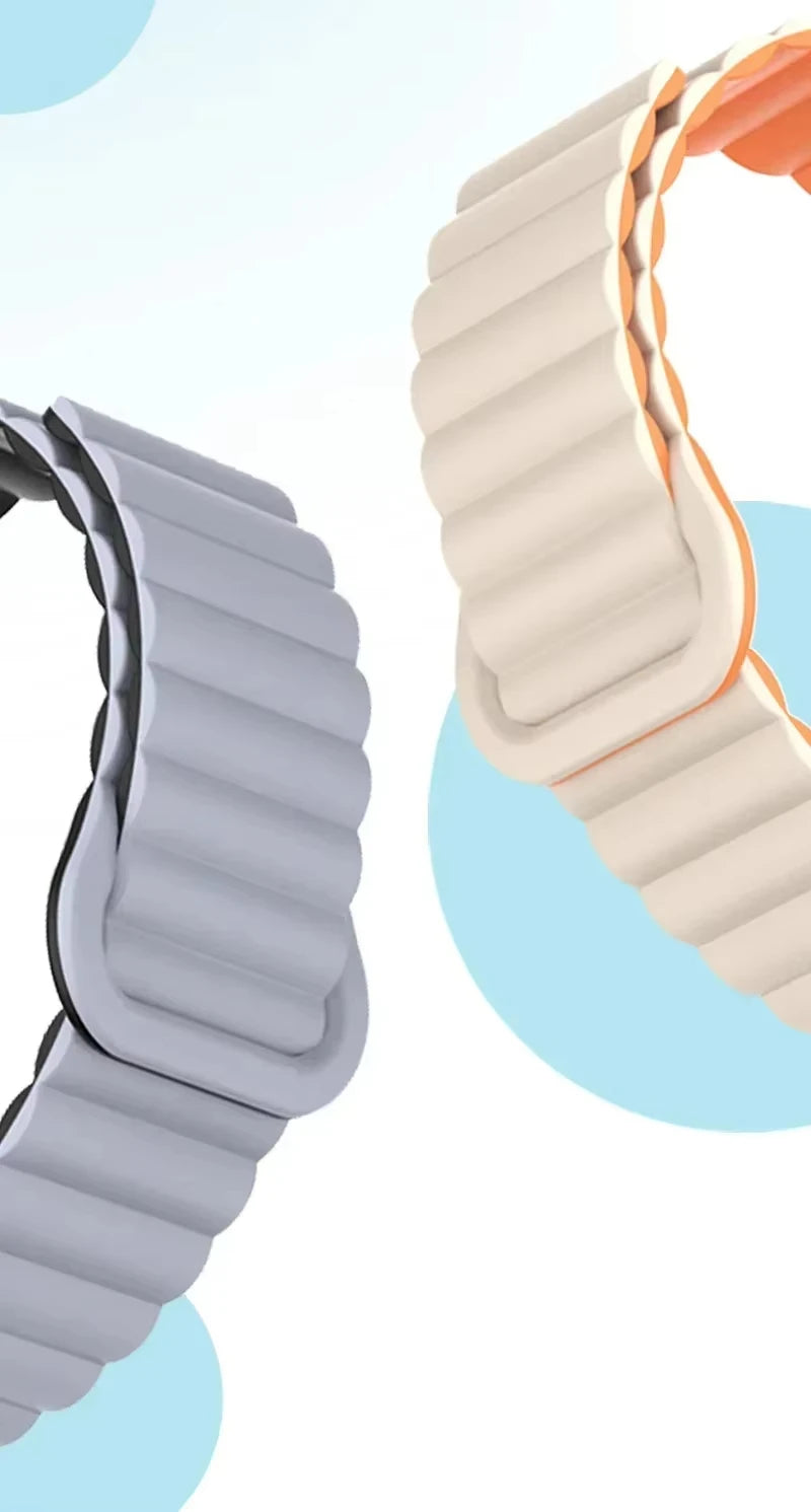 Close-up view of two adjustable magnetic loop watch bands, one gray and one orange.