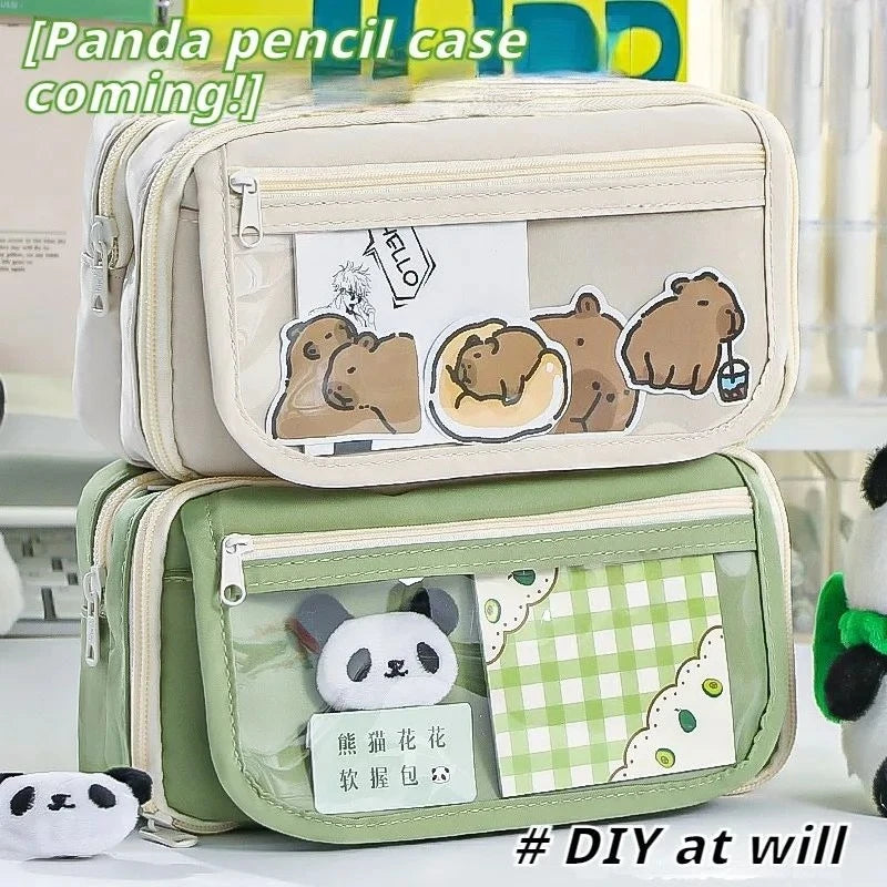 A light beige pencil case featuring a transparent flip pocket with cute panda-themed decorations.