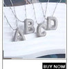 A set of gold-plated shell pearl beaded necklaces spelling out the letters A through D.