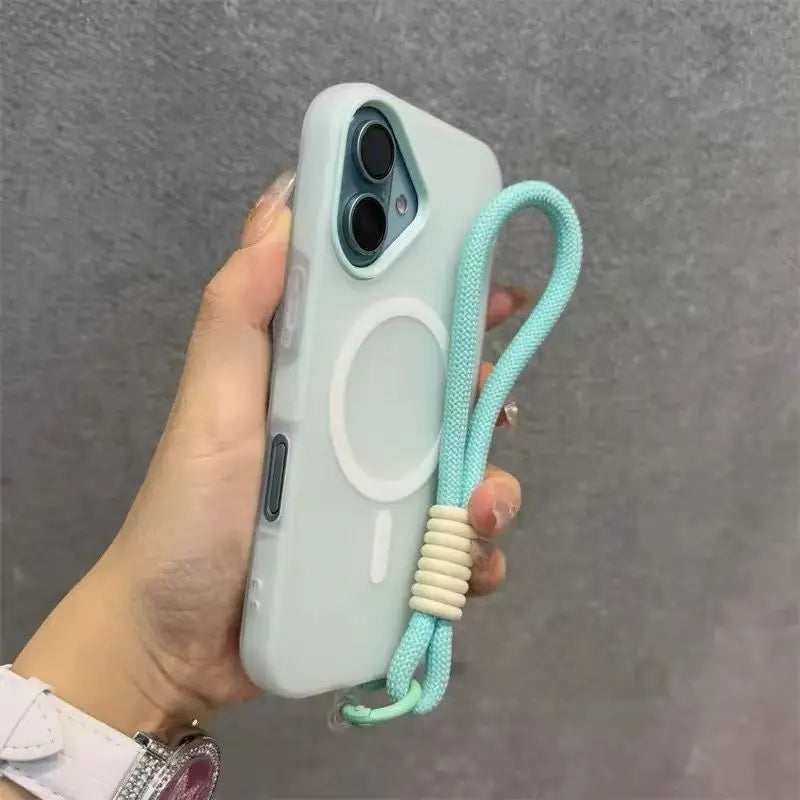 A hand holds a light blue phone case with a lanyard attached, featuring a magnetic candy design.
