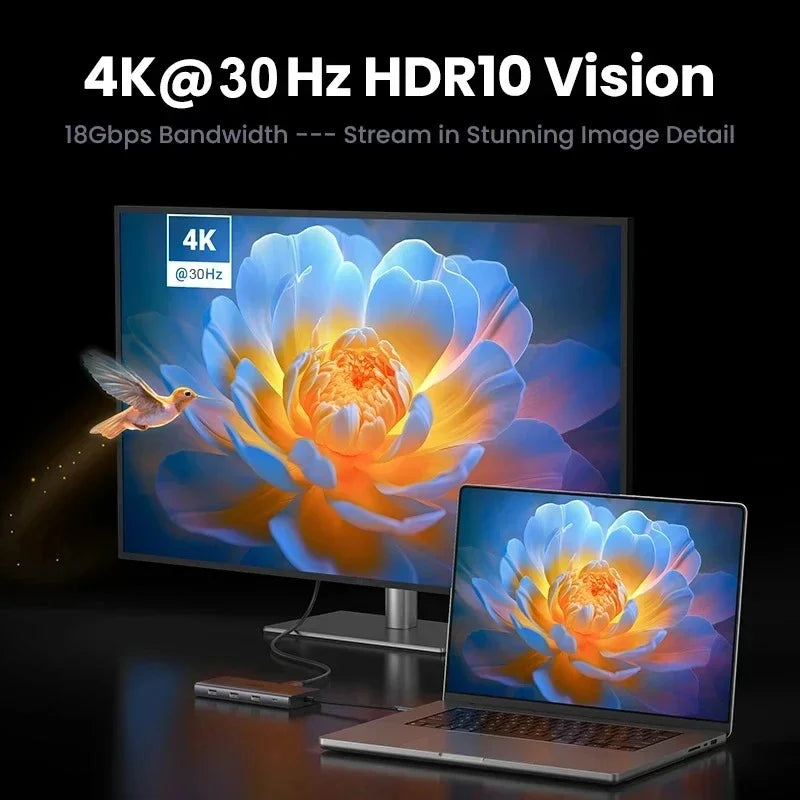 A laptop is shown next to a monitor displaying a vibrant 4K HDR10 vision image of a flower.