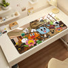 A colorful cartoon mouse pad featuring various animated characters and scenes on a white desk.