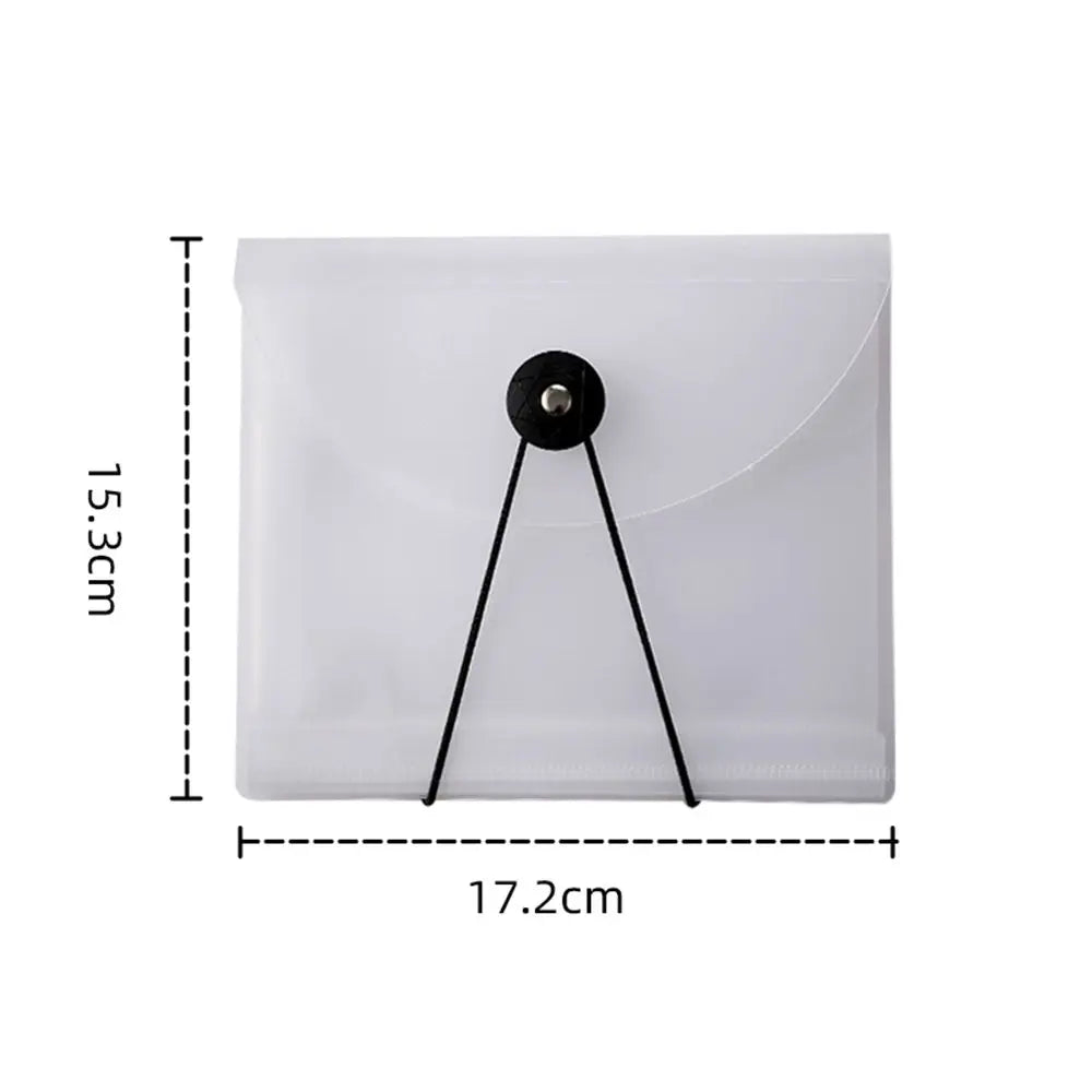 A clear plastic storage book with a black clip for holding stickers and documents.