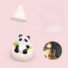 A white panda-shaped LED desk lamp with a flexible arm and a mobile phone holder on a pink background.