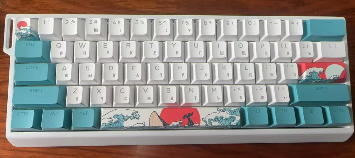 A white aluminum mechanical keyboard with light blue and red keycaps and a red flag design.