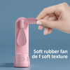 A hand holds a pink portable foldable rabbit mini fan with soft rubber texture against a blue background.