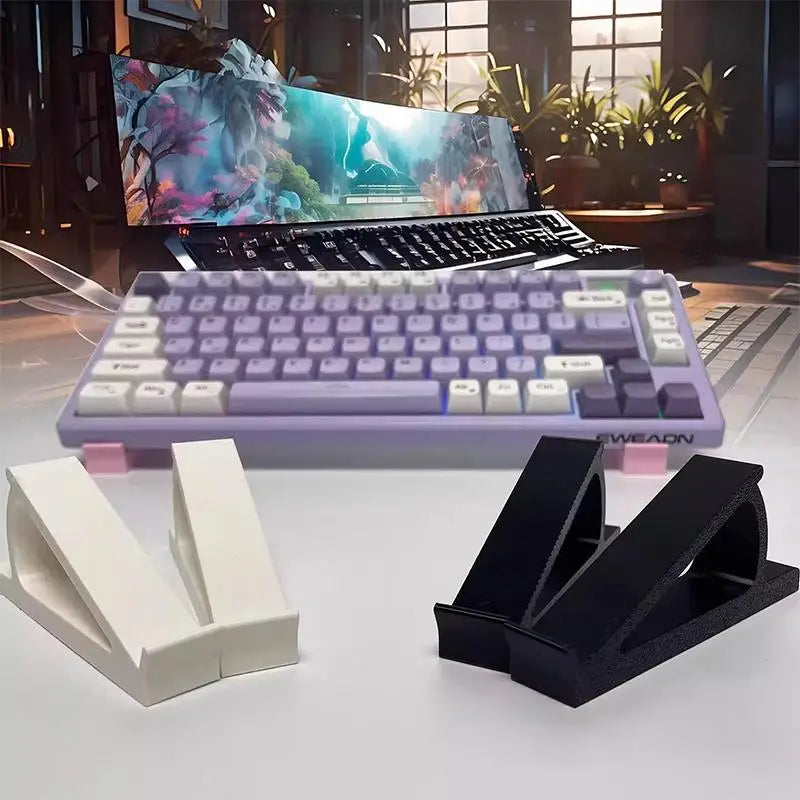 A purple ergonomic keyboard height adjuster stand with white keyboard components and a laptop displaying a vibrant scene.