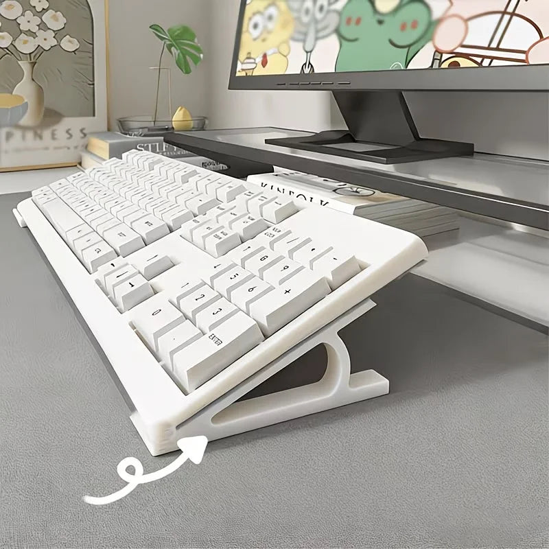 A white adjustable keyboard tray riser set is shown on a desk, positioned to elevate a keyboard for ergonomic typing.