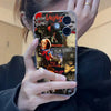 A hand holds an iPhone case featuring a collage of horror movie posters, including Seasonings Creepings and Halloween themes.