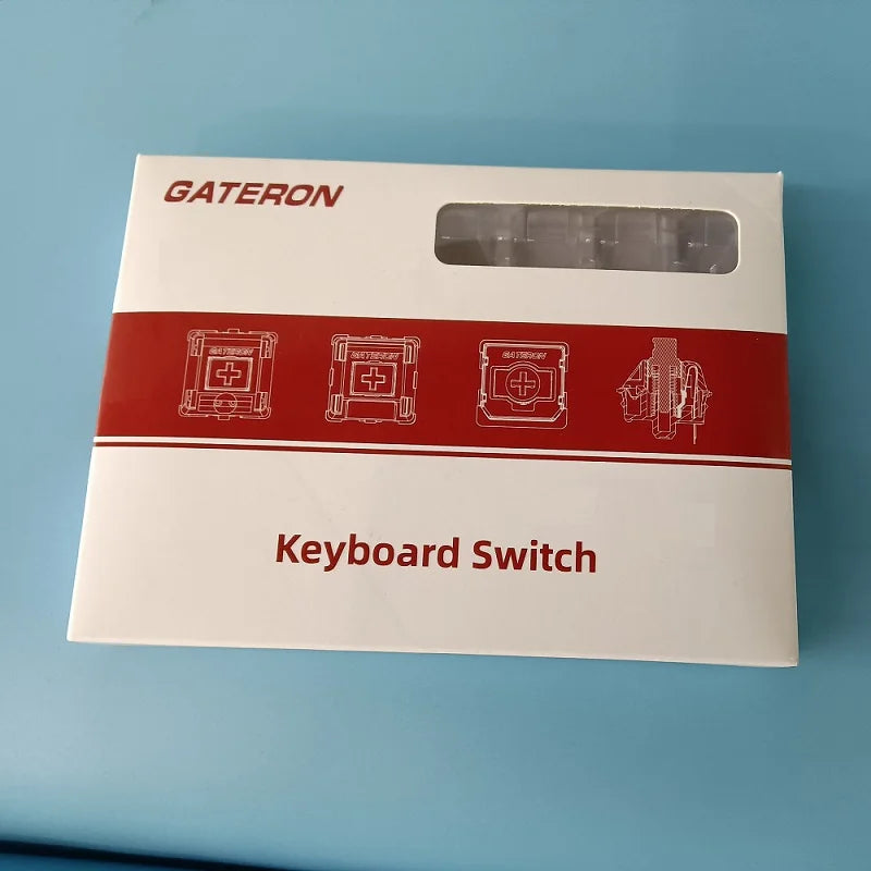 A white plastic product box for a Gateron Keyboard Switch, showing various switch types and an empty slot.