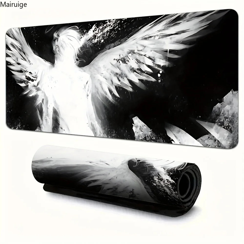 Black and white artistic image of a large angel wing on a desk mat or mouse pad