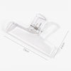 A clear plastic book page clip with a tapered shape shown against a white background.