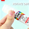 A hand is squeezing a white glue stick labeled Glue Stick PVA 21g for craft use.
