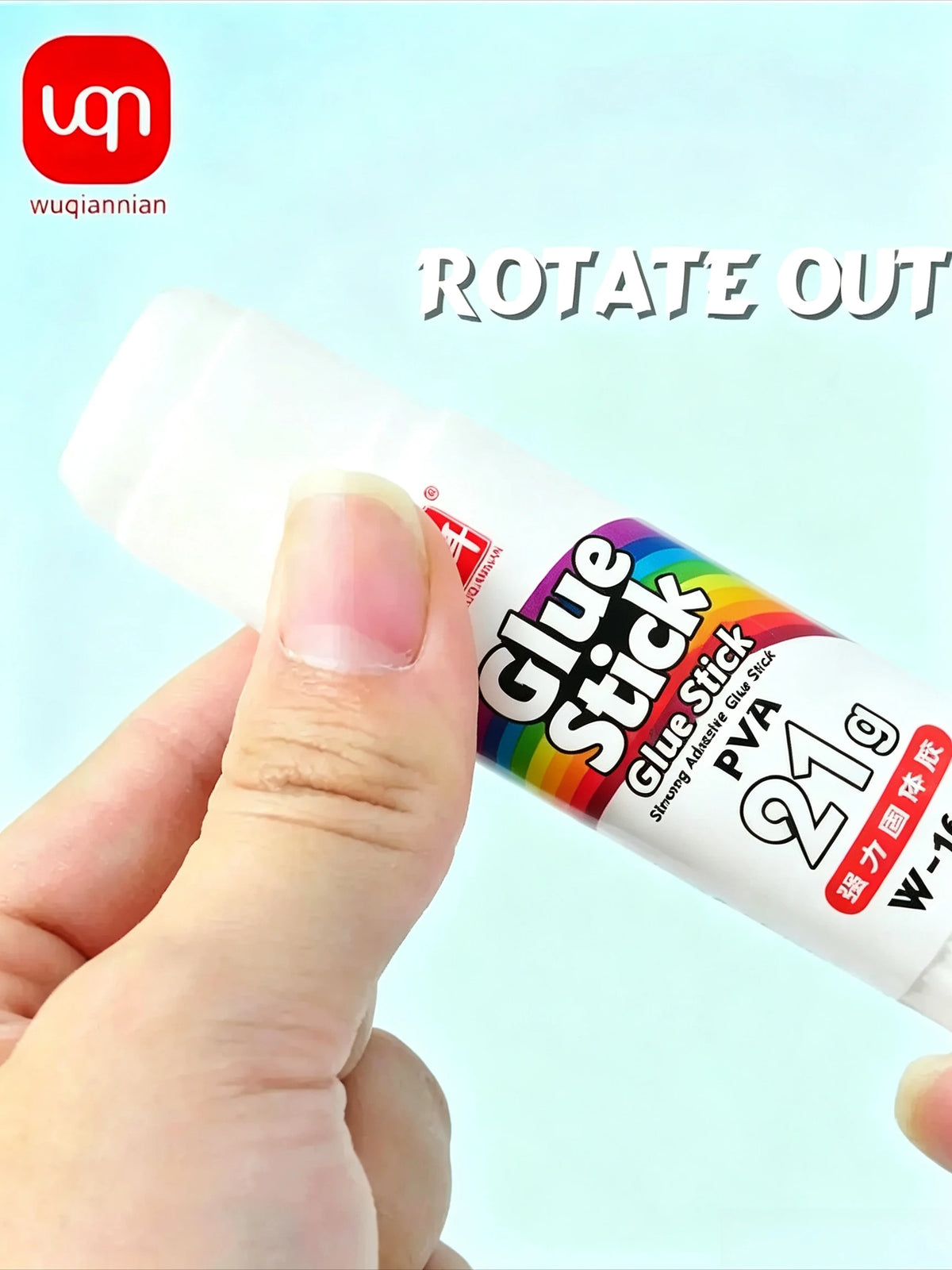 A hand is squeezing a white glue stick labeled Glue Stick PVA 21g for craft use.