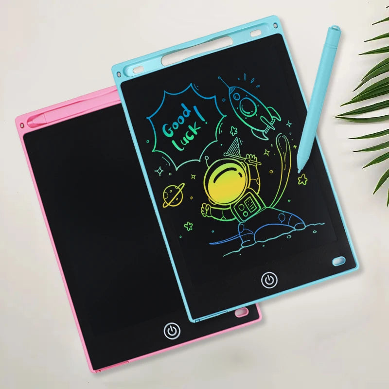 A pink and blue portable LCD drawing tablet with a screen displaying a 'Good luck!' message and various drawings.