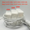 Three white universal DC power adapters with various voltage and current ratings are coiled together.