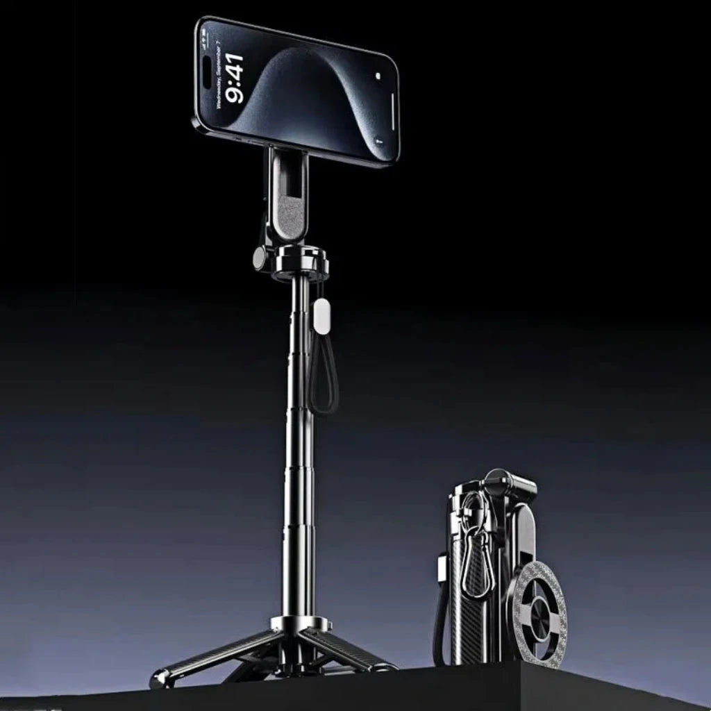A black magnetic selfie stick with a smartphone attached is displayed on a stand.