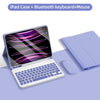A purple iPad case is shown with a Bluetooth keyboard and mouse placed next to it on a purple surface.