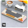 A compact 68-key wired mechanical gaming keyboard with anti-ghosting features is shown next to a coffee cup.