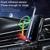 A smartphone is mounted on a car vent using an infrared sensor for wireless charging.