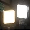 A close-up view of a mini clip-on LED fill light with a square white light panel mounted on a gray base.